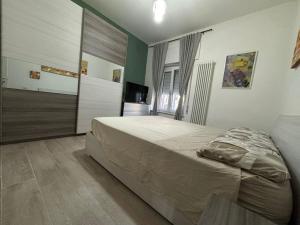 Ένα ή περισσότερα κρεβάτια σε δωμάτιο στο Suite Vento d'Estate