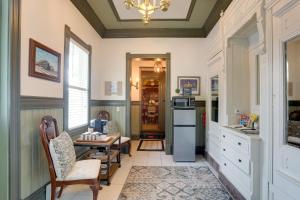 a kitchen with a table and chairs and a chandelier at The Presidential Stay, Converted Railcar in DuBois in Adrian Furnace
