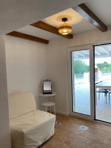 a living room with a bed and a table with a tv at Sunny Aljezur da Misericórdia, Aljezur, Costa Vicentina in Aljezur