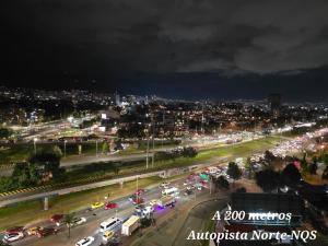 a busy city street with traffic at night at Hotel Castellana 95 Bogota By Hoteles Confort 80 in Bogotá