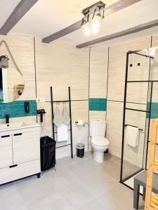 a bathroom with a toilet and a sink at El Boulevard de Trujillo 1997 in Trujillo +27 photos