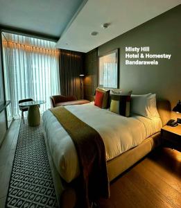 a bedroom with a large bed in a room at Misty Hill Hotel & Homestay Bandarawela in Bandarawela