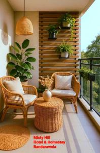 a patio with wicker chairs and a table and a balcony at Misty Hill Hotel & Homestay Bandarawela in Bandarawela