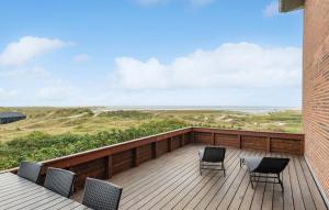 a balcony with chairs and a view of the ocean at Awesome Apartment In Fanø With Sauna in Fanø