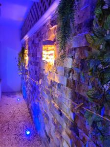 a brick wall with a light on it at Chan Kiin Departamentos in Valladolid