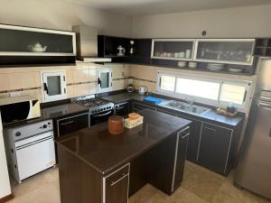 a kitchen with a large island in the middle at Pueblo Maschwitz in Ingeniero Maschwitz