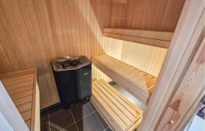 an inside view of a sauna with a trash can at Nice Home In Gol With Sauna in Holtegard