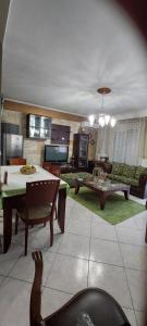 a living room with a couch and a table at Comfortable and Elegant apartment FoFi in Thessaloniki