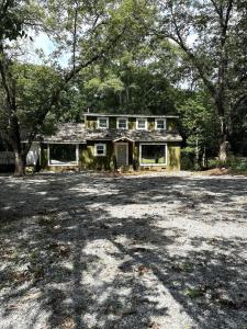 a house with a large driveway in front of it at The Lofted Retreat in Newnan