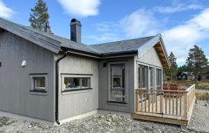 a house with a porch and a deck at 2 Bedroom Beautiful Home In Gålå in Gålå
