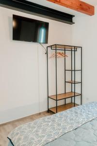 a room with a book shelf and a bed at Romantic Boutique Apartment 2 in Villajoyosa