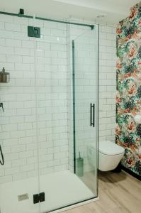 a glass shower in a bathroom with a toilet at Romantic Boutique Apartment 2 in Villajoyosa
