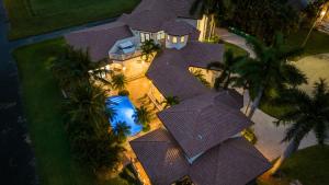 an overhead view of a large house with a roof at Luxury Italian Type Villa 7k SQ FT Heated Pool in Melalevca Isles