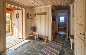 a hallway of a house with a door and a rug at Awesome Home In Eggedal With Sauna in Eggedal