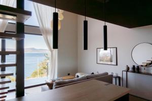 a living room with a view of the ocean at Costa Susana Ushuaia in Ushuaia