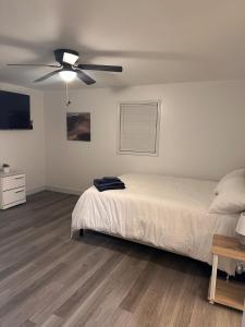 a bedroom with a bed and a ceiling fan at Newnan Oasis in Newnan