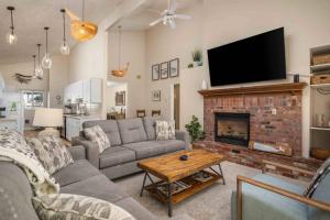 a living room with a couch and a fireplace at Beachfront Family Sanctuary in Rockaway Beach