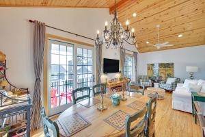 a dining room and living room with a wooden ceiling at Walk to Dtwn Syracuse Private Lake-View Home in Syracuse
