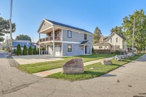 a house with rocks in front of it at Walk to Dtwn Syracuse Private Lake-View Home in Syracuse