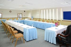a conference room with long tables and chairs at Lake Kariba Inns in Siavonga