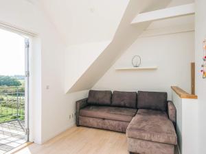 a living room with a couch and a window at 5 star holiday home in Rømø in Sønderby +35 photos