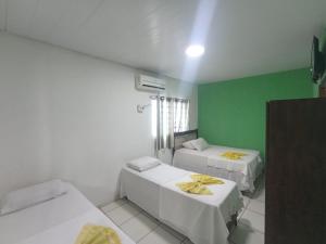 Ένα ή περισσότερα κρεβάτια σε δωμάτιο στο Pousada casa verde