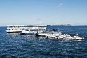 a group of boats docked in the water at Lake Kariba Inns in Siavonga