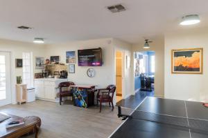 a living room with a ping pong table in it at Desert Dream Airstream in Yucca Valley