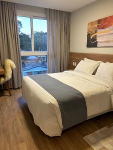 Voodi või voodid majutusasutuse Nova Suite | 304 | Piscina | Academia | Sauna toas