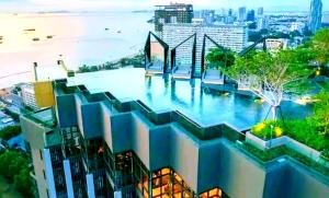 a building with a large swimming pool on top of it at The Edge Infinity in Pattaya