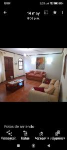 a living room with two couches and a coffee table at Arriendo de habitación amobladas centro de la ciudad de la serena chile in La Serena