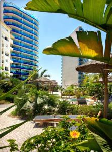 a resort with a table and chairs and buildings at Rock view Apartment at ocean village in Gibraltar