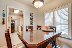 a dining room with a wooden table and chairs at Walkable Miracle Mile Retreat with Peaceful Patio in Stockton