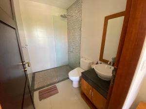 a bathroom with a toilet and a sink at ThreeWin Homestay in Ubud +92 photos