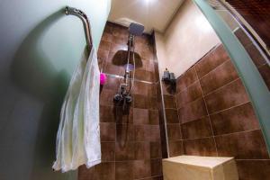 a bathroom with a shower with a toilet and a shower at Cozy apartment in Rabat Agdal in Rabat
