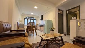 a living room with a couch and a table at 21 Tara Apartments in Kathmandu