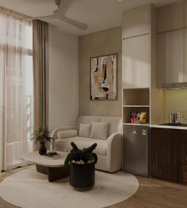 a living room with a couch and a table at The Kind Villas Phu Quoc in Phu Quoc