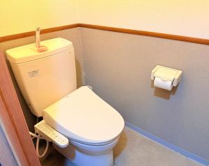 a bathroom with a toilet and a roll of toilet paper at M-Haneda Lex Apartment 137sqm 3BDR Max24 PPL 1min from Sta FreeParking in Tokyo +24 photos