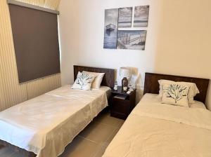プンタ・カナにあるGetaway in Serenaの部屋に並んで置かれた2つのベッド