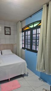 Ένα ή περισσότερα κρεβάτια σε δωμάτιο στο Pousada Top Mix 101
