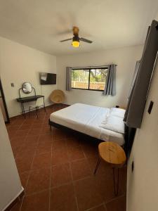 Una cama o camas en una habitación de Finca Dos Encinos