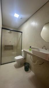 a bathroom with a sink and a toilet at Apê da Bella seu refúgio no Caparaó in Alto Caparao