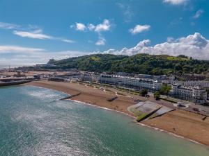 an aerial view of a beach with buildings and trees at Dover Marina Hotel & Spa, Tapestry Collection by Hilton in Dover