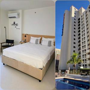 Un dormitorio con una cama grande y un edificio. en Quarto 5 estrelas no Comfort Suites!, en Brasilia
