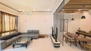 a living room with a couch and a table at Chun House in Jiali