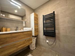 a bathroom with a sink and a mirror at App 4-6 Pers - Terrasse - Calme - Reposant in La Chambre +41 photos