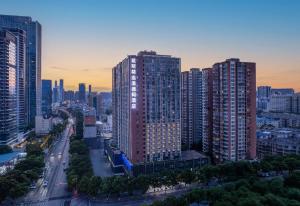 an aerial view of a city with tall buildings at Days Inn by Wyndham Changsha Yuanda Road in Changsha