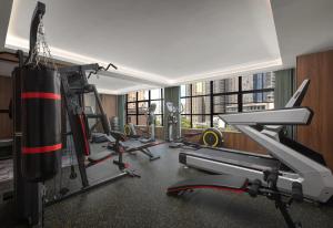 a gym with several gym equipment in a room at Days Inn by Wyndham Changsha Yuanda Road in Changsha