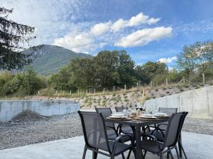 a table and chairs sitting on a patio at App 4-6 Pers - Terrasse - Calme - Reposant in La Chambre