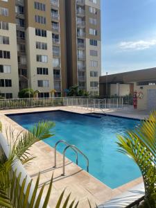 a large swimming pool in the middle of a building at Apartamento NIZA in Valledupar